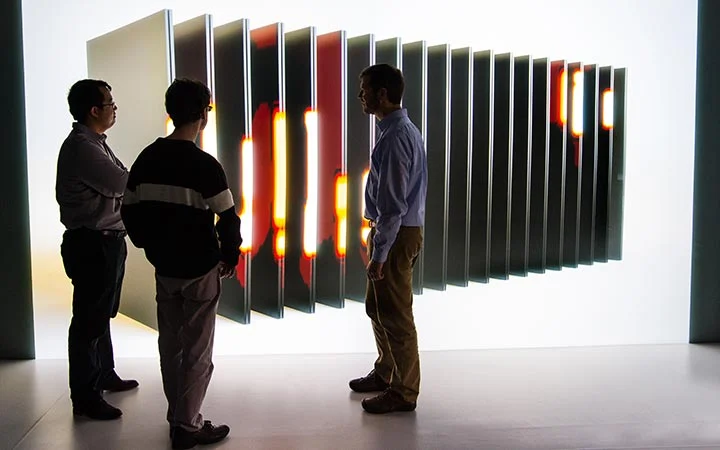 energy-storage-41710 Researchers evaluate simulation stills of a battery in a 3-D visualization room.