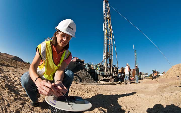 research-areas-17906 Researcher examines a heat sensor.