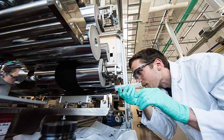 research-areas-42701 A researcher coats a fuel cell catalyst layer onto carbon-paper diffusion media.