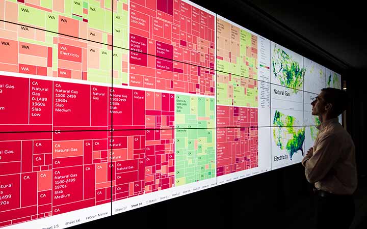 research-areas-45438 Researcher reviews and analysis tool projected on a wall.